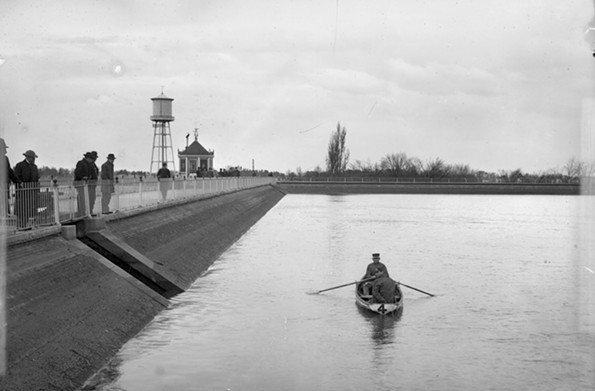This image from about 1890 captures a rower and parkgoers at one of the lakes in the city’s New Reservoir Park at the foot of Clover Street, now Arthur Ashe Boulevard. The park was renamed Byrd Park. - THE VALENTINE