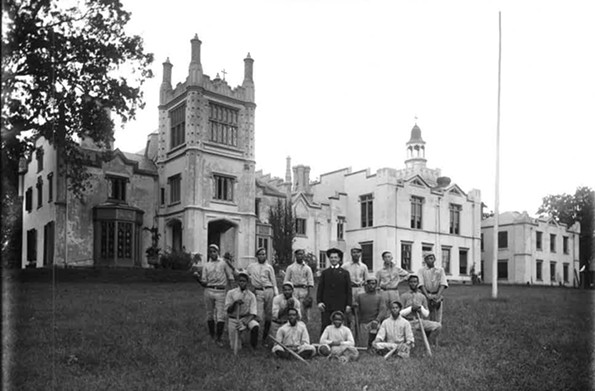 The baseball team of St. Emma Industrial and Agricultural Institute in Powhatan County pose in the early 20th century in front of Belmead. The former plantation house, which still stands, served the private African-American boys school for 77 years. - THE VALENTINE