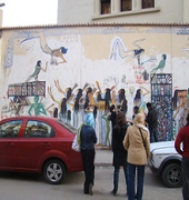 Passersby and journalists eagerly...