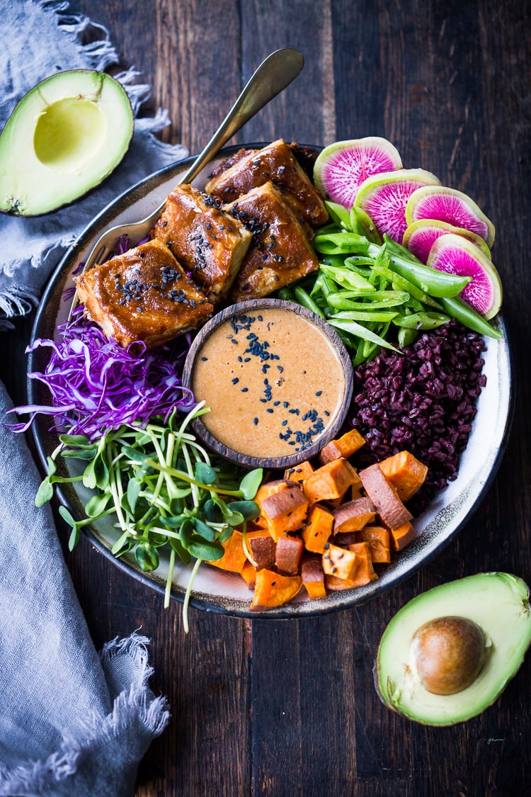 Our 20 BEST Buddha Bowls!| Bali Bowl with Peanut Tofu, black rice, roasted sweet potatoes, shredded cabbage, radish and snow peas. #peanutsauce #peanuttofu #healthybowl #veganbowls #buddhabowls #vegan #plantbased #cleaneating #eatclean #detoxrecipes #balifood #balinese