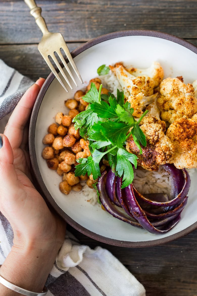 Tandoori Glory Bowl with Roasted cauliflower, chickpeas, (or optional chicken.) Cook it all on one sheet-pan in 30 mins flat! Vegan, GF | #veganbowl #healthybuddhabowl #buddhabowl #vegan #cleaneating #eatingclean #eatclean #detox #cauliflower #healthybowl | www.feastingathome.com