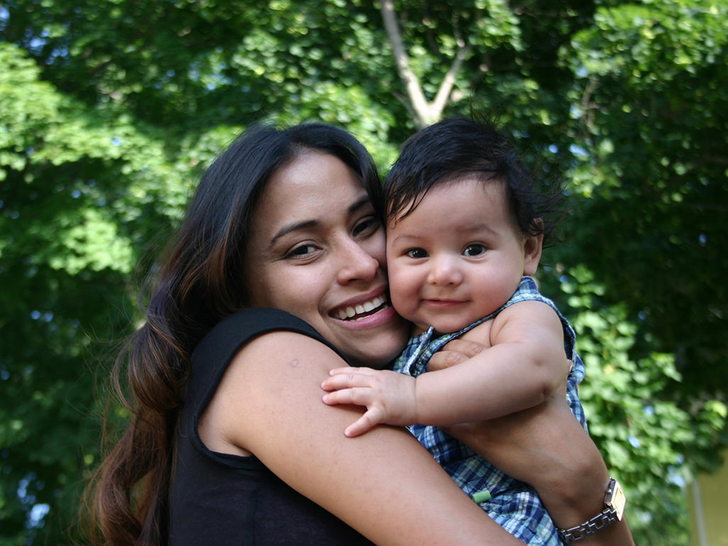 mother hugging her baby